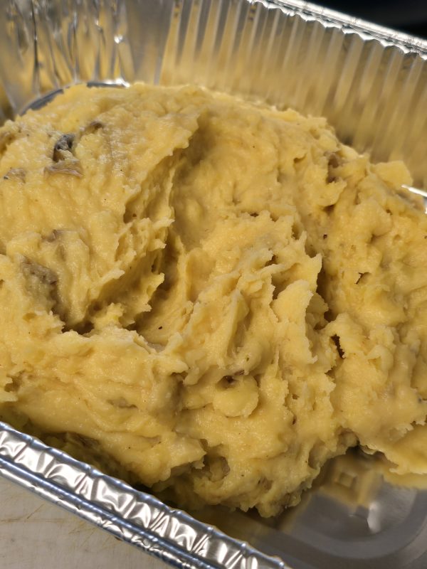 Foil pan full of Woy Mezanmi mashed potatoes