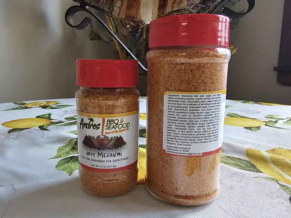 Small and large bottle of Woy Mezanmi seasoning