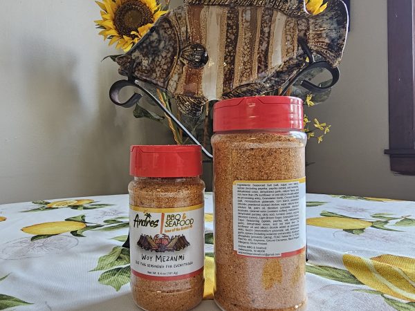 Small and large bottle of Woy Mezanmi seasoning